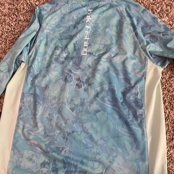 The brand of the shirt is hog fishing and it is a youth large. - Picture 2 of 2
